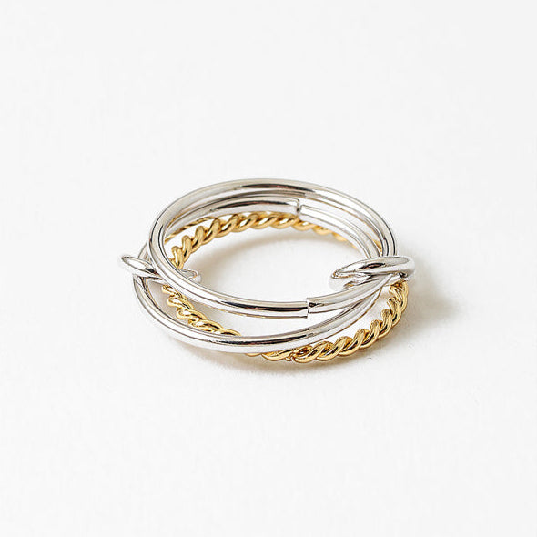 A mixed-metal adjustable ring inspired by ocean movement. 18k gold-filled and 925 sterling silver, water resistant, hypoallergenic, and made to flow with you.