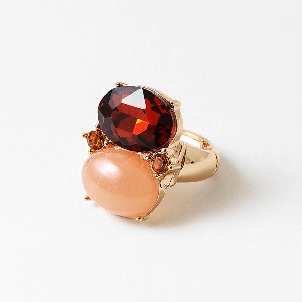 An adjustable ring featuring glass crystal and resin stones set in 18k gold-filled metal. Waterproof, lightweight, and designed for everyday shine.