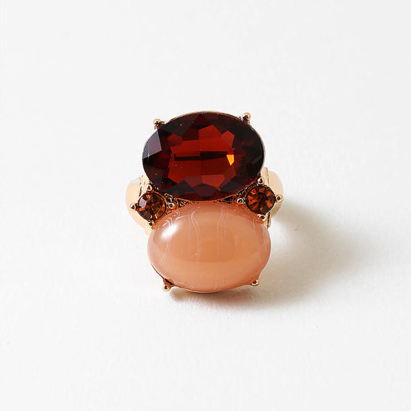 An adjustable ring featuring glass crystal and resin stones set in 18k gold-filled metal. Waterproof, lightweight, and designed for everyday shine.