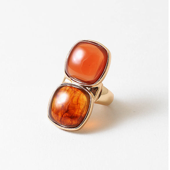 Stretch Gold ring with two large orange gemstones