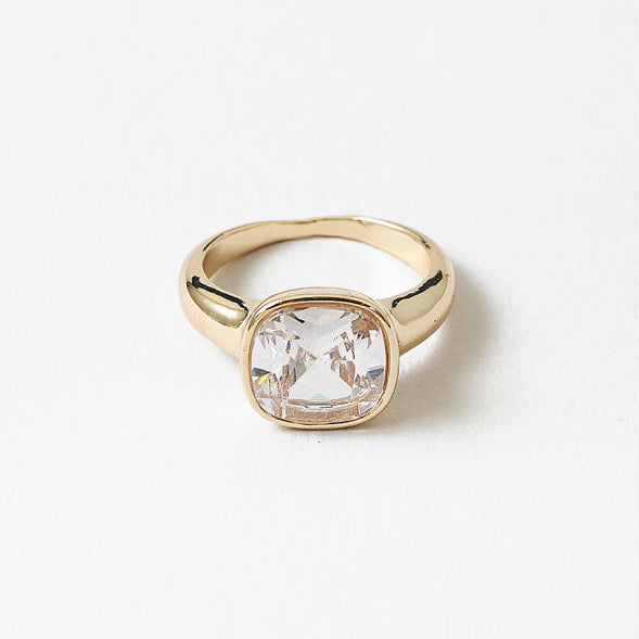 18k gold-filled ring with a faceted square cubic zirconia in a smooth, timeless setting.&nbsp;Minimal yet luminous, this timeless design is made to be worn every day—effortless, refined, and full of light.