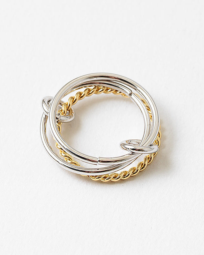 A mixed-metal adjustable ring inspired by ocean movement. 18k gold-filled and 925 sterling silver, water resistant, hypoallergenic, and made to flow with you.