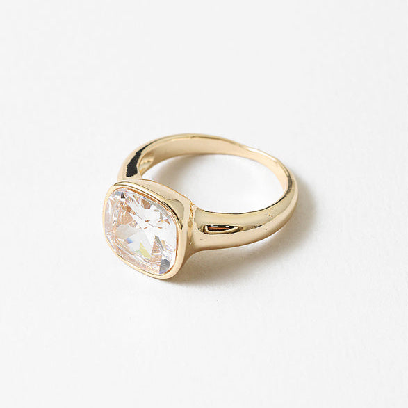 18k gold-filled ring with a faceted square cubic zirconia in a smooth, timeless setting.&nbsp;Minimal yet luminous, this timeless design is made to be worn every day—effortless, refined, and full of light.